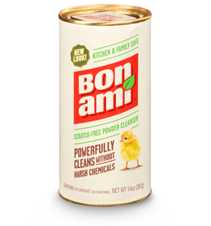The Bon Ami Powder Cleanser comes in a cylindrical container, featuring a yellow chick illustration. Its label highlights Scratch-Free, Kitchen & Family Safe, and Powerfully Cleans Without Harsh Chemicals. Made with sustainable agents, the cleanser weighs 14 oz (397g).