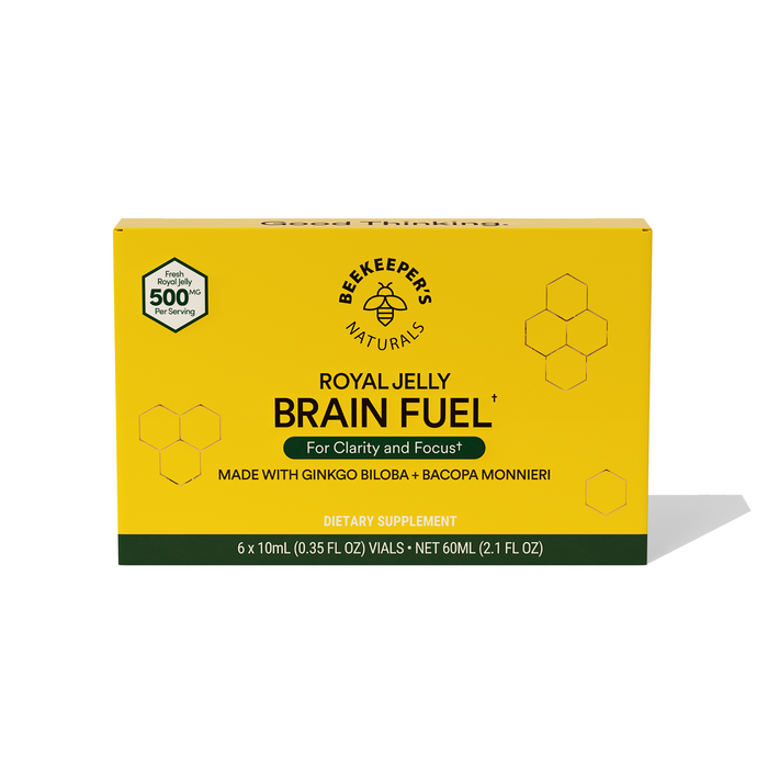 A yellow box of Beekeeper’s Naturals Royal Jelly Brain Fuel dietary supplement, featuring honeycomb graphics and text highlighting ingredients like ginkgo biloba and bacopa monnieri.