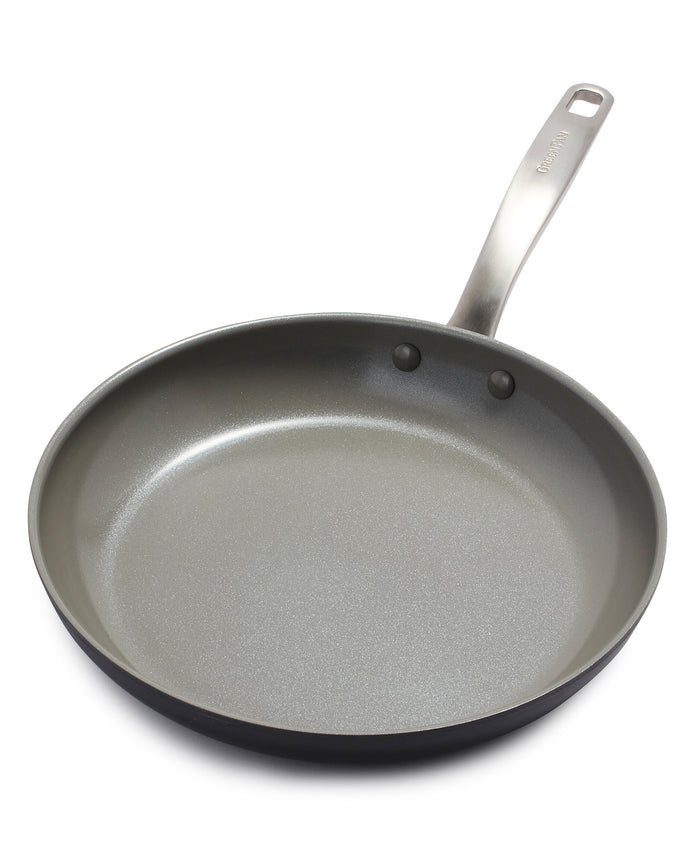 A nonstick frying pan with a metallic handle, shown against a white background. The pan has gently sloped sides and a smooth, gray cooking surface.