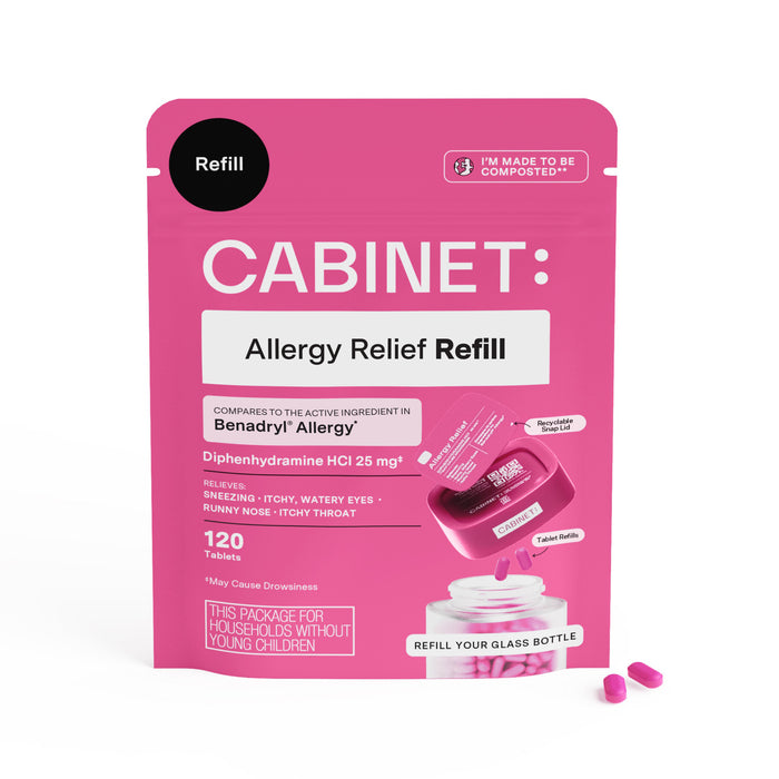 A pink package labeled CABINET: Allergy Relief Refill contains 120 tablets. The package highlights diphenhydramine as the main ingredient and includes allergy symptoms treated. Two pink tablets are next to the package.