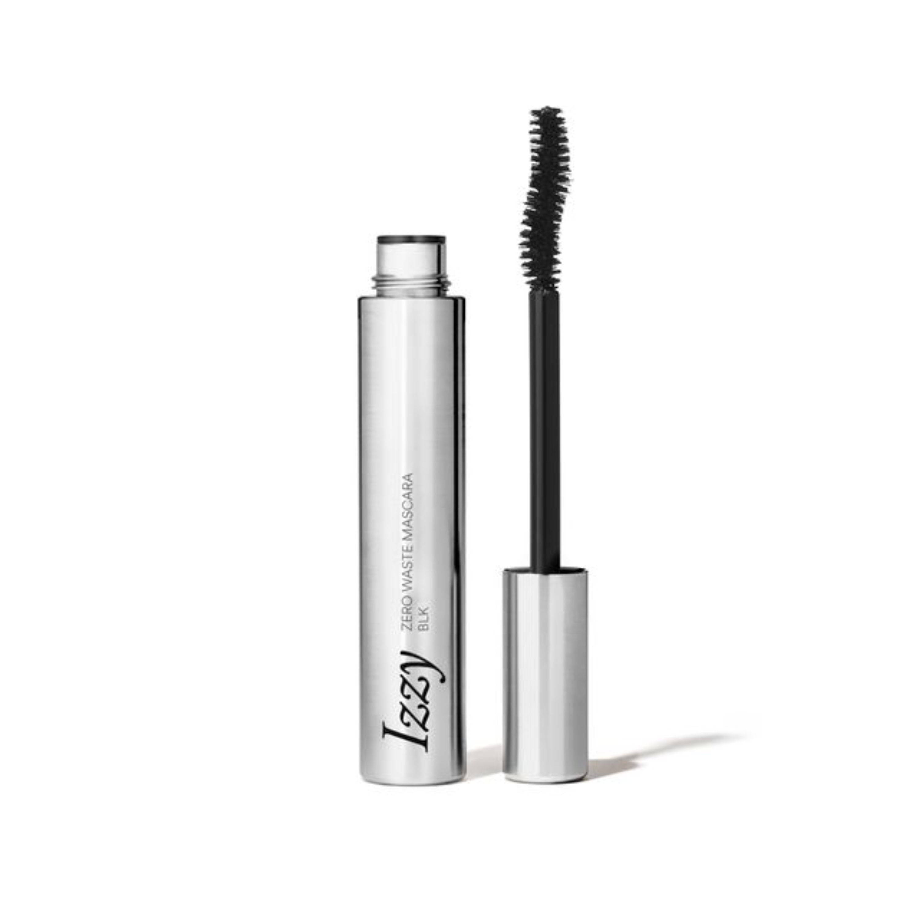 A silver IZZY Zero Waste Beauty Zero Waste Mascara stands upright with its curved wand brush showcasing dark mascara bristles. The cap rests beside it, emphasizing the sleek, cruelty-free, and sustainable design of this metallic mascara.