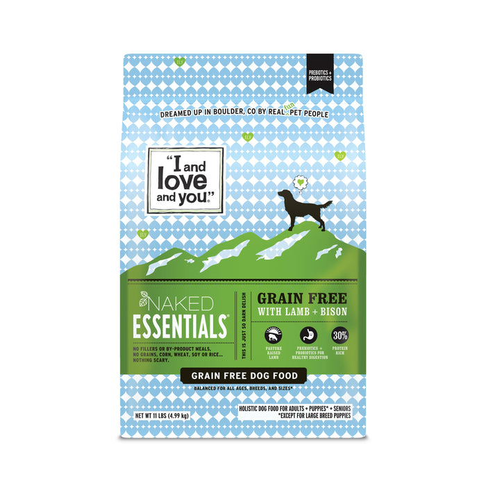 A bag of I and love and you Naked Essentials Grain Free Dog Food with Lamb + Bison. The design features a black dog silhouette on green hills against a blue patterned background. The bag is 11 lbs.