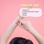 A person scrubs their forearm with a purple substance against a pink background. Text reads: HOW TO USE: 1. Break off 2. Loosen with warm water 3. Scrub 4. Rinse.