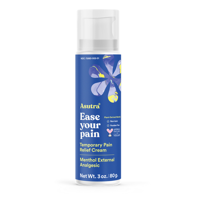 A blue bottle of Asutra Ease Your Pain Temporary Pain Relief Cream with a floral design, labeled as menthol external analgesic, vegan, paraben-free, and plant-derived. Net weight: 3 oz (180 g).