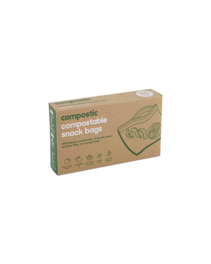 A box of compostic compostable snack bags with green text and illustrations of fruits and a snack bag. The box highlights eco-friendly features and contains 20 bags.