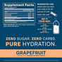 Supplement facts label and instructions for a grapefruit-flavored hydration powder. Key points: zero sugar, zero carbs, pure hydration. Directions advise mixing with cold water. Highlights organic natural flavors. Navy and orange theme.
