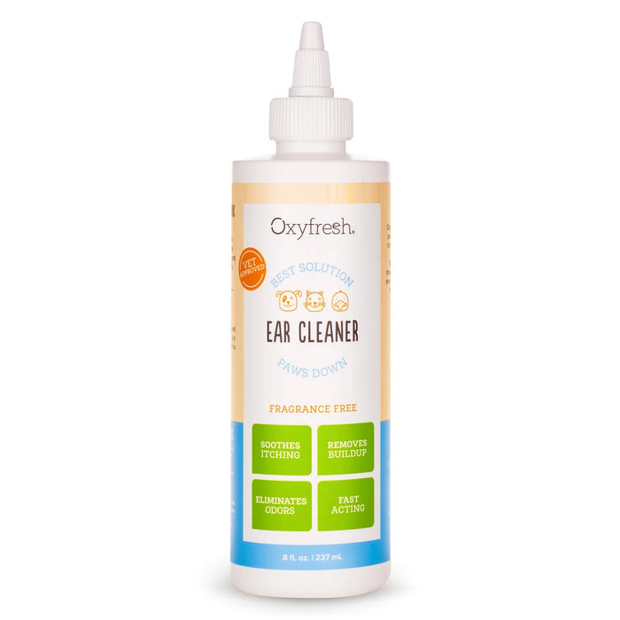 A bottle of Oxyfresh Ear Cleaner for pets with an orange and blue label, featuring claims like fragrance free, soothes itching, removes buildup, eliminates odors, and fast acting.