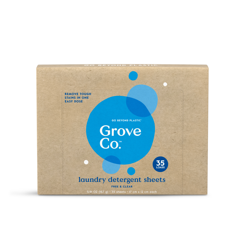A brown box labeled Grove Co. with blue circles, containing 35 laundry detergent sheets. Text reads Remove tough stains in one easy dose and Free & Clear. The packaging is minimal and eco-friendly.