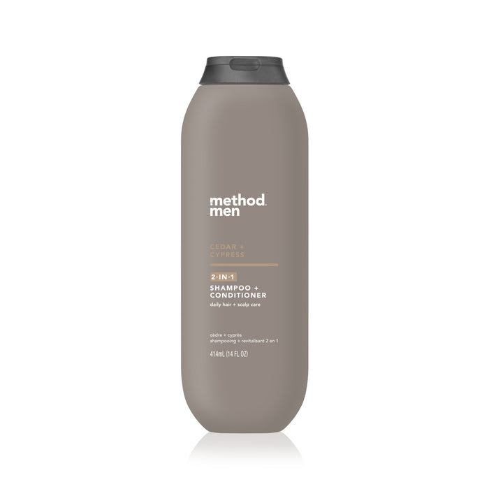 A gray bottle of Method Men Cedar + Cypress 2-in-1 Shampoo + Conditioner, 414 mL size, with white text and a black flip-top cap, shown on a white background.