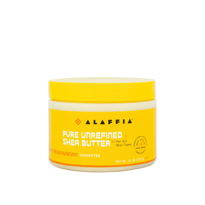 A yellow and white container of Alaffia Pure Unrefined Shea Butter, unscented, for all skin types. The label shows it is ethically traded and handcrafted, with a net weight of 11 ounces (312 grams).