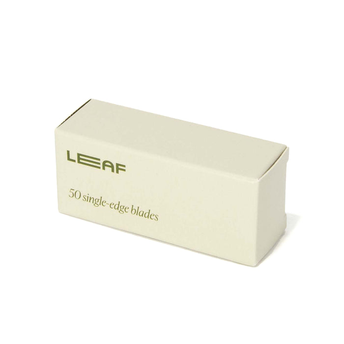 A rectangular beige box labeled LEAF and 50 single-edge blades in green text, indicating it contains fifty single-edge razor blades.