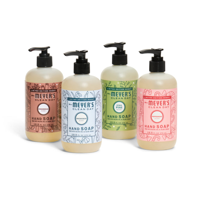 The Mrs. Meyer’s Holiday Hand Soap Collection features four cheerful bottles, each with a pump dispenser and colorful label, in seasonal scents: honeysuckle, rosemary, lemon verbena, and peppermint.
