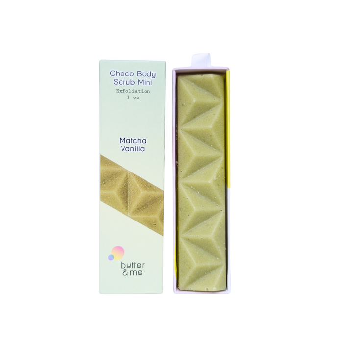 A rectangular box labeled Choco Body Scrub Mini, Exfoliation, Matcha Vanilla stands next to an open package showing a green, textured scrub bar with geometric patterns. The brand butter & me is on the box.