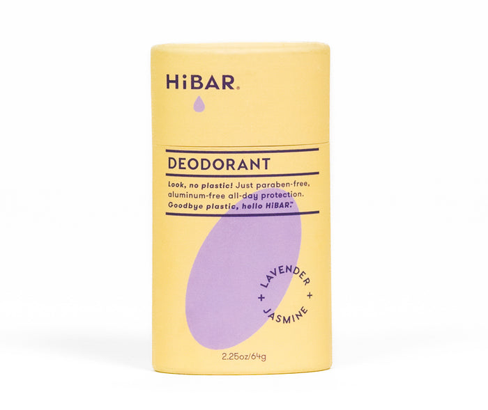 A yellow and purple HiBAR deodorant stick with Lavender + Jasmine scent. The label highlights that it is paraben-free, aluminum-free, and plastic-free, offering all-day protection.