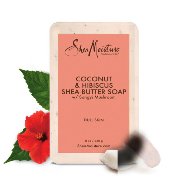 The SheaMoisture Coconut Hibiscus Shea Butter Bar for dull skin is shown in its vibrant orange packaging, adorned with a hibiscus flower, coconut piece, and green leaves, enriched with nourishing coconut oil.