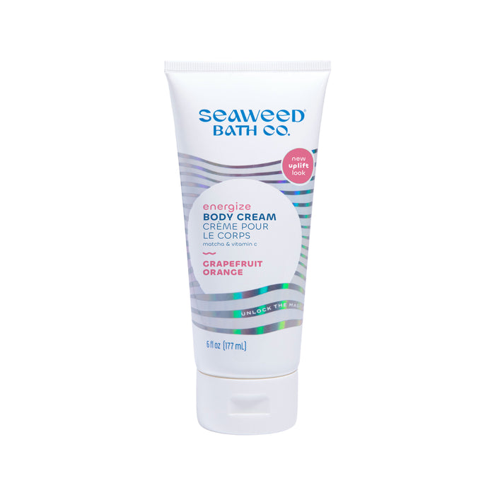 A tube of Seaweed Bath Co. Energize Body Cream in Grapefruit Orange scent, featuring a white and silver design with teal and orange text. The tube holds 6 fl oz (177 mL) and has a flip-top cap.