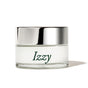 The Dew Bomb Glowy Hydra-Milk Starter Kit by IZZY Zero Waste Beauty features a small glass jar with a shiny silver lid and green Izzy text. It contains white cream infused with triple-layer hyaluronic acid, ideal for deep hydration and leaving your skin with a glowy finish.