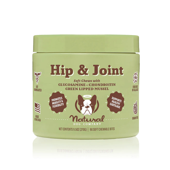 A green container labeled Hip & Joint soft chews for dogs by Natural Dog Company, featuring ingredients like glucosamine, chondroitin, and green-lipped mussel, and icons highlighting benefits for mobility and cartilage health.