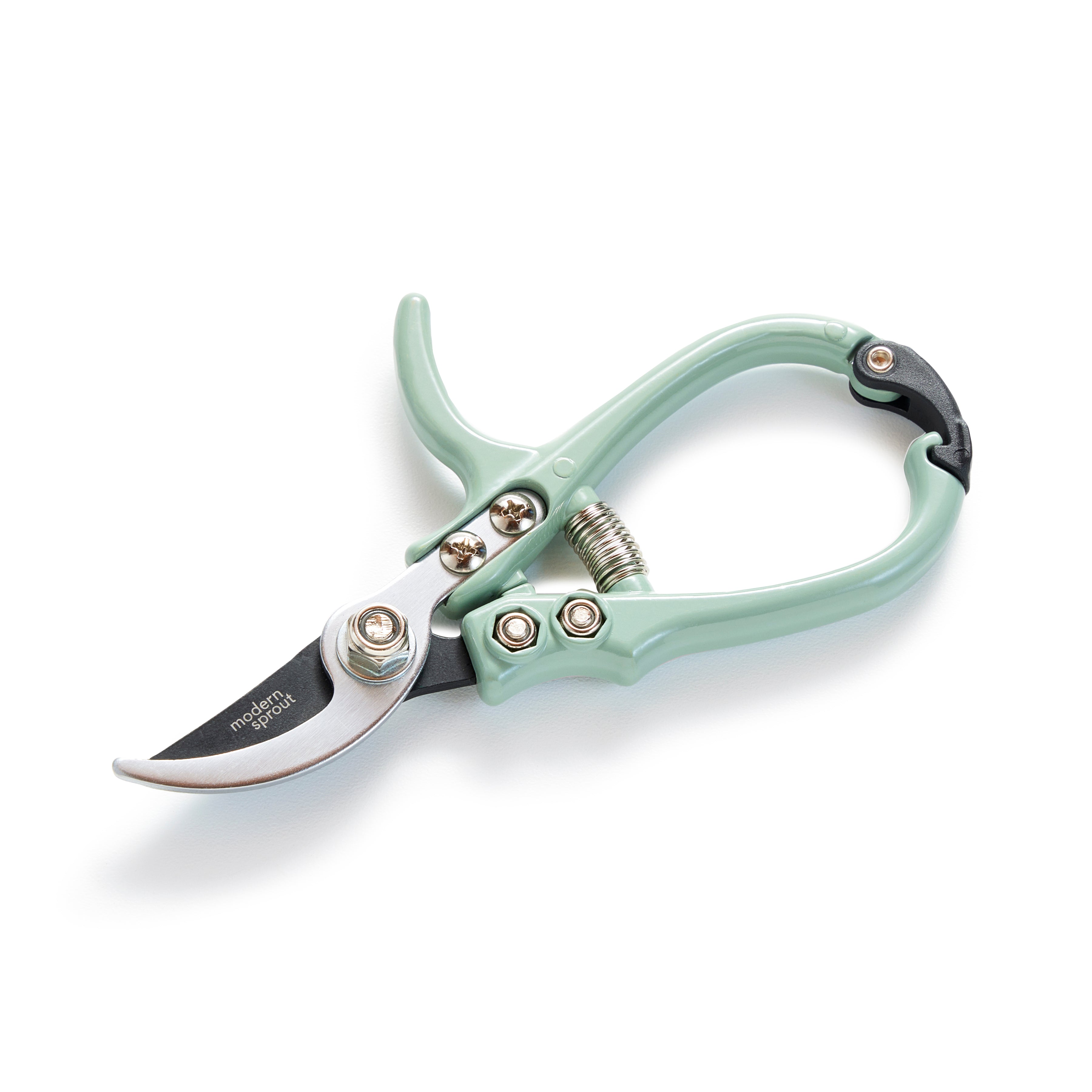 The Modern Sprout Garden Pruners feature light green handles and a silver carbon steel blade with a spring mechanism. The ergonomic design ensures comfort, and the open design displays the sharp curved bypass blade.
