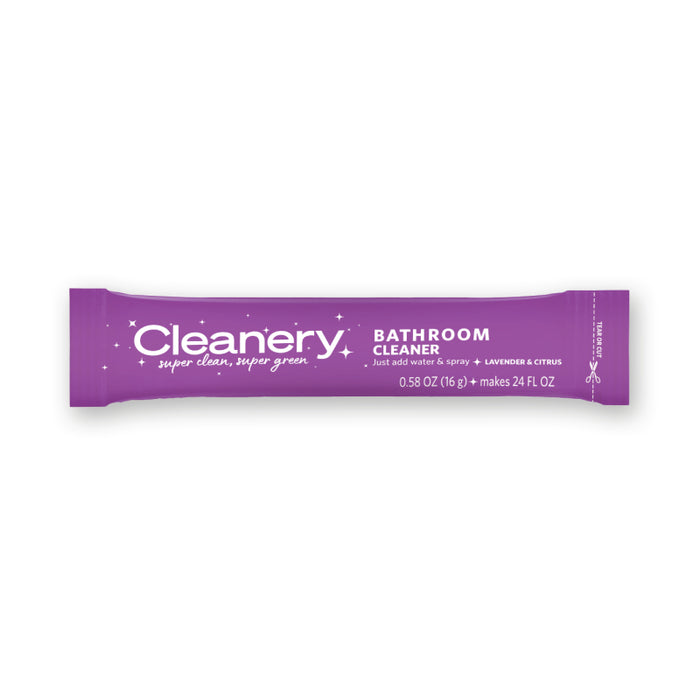 A purple packet labeled Cleanery Bathroom Cleaner with lavender and citrus scent. Text indicates it makes 24 fl oz of cleaner by adding water. The packet weighs 0.58 oz (16 g).