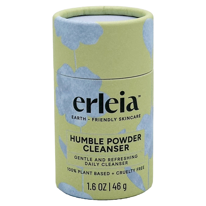A cylindrical container of Erleia Humble Powder Cleanser with a green and blue floral design. The label states it is earth-friendly, gentle, plant-based, and cruelty-free, with a net weight of 1.6 oz (46 g).