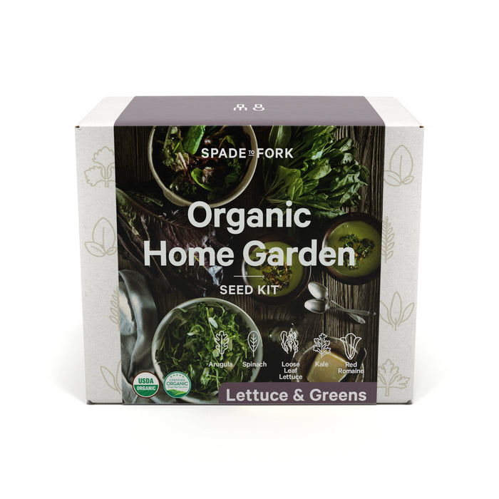 A box labeled Spade to Fork Organic Home Garden Seed Kit features images of leafy greens. The kit includes arugula, spinach, loose leaf lettuce, kale, and red romaine. USDA Organic and Non-GMO symbols are visible.