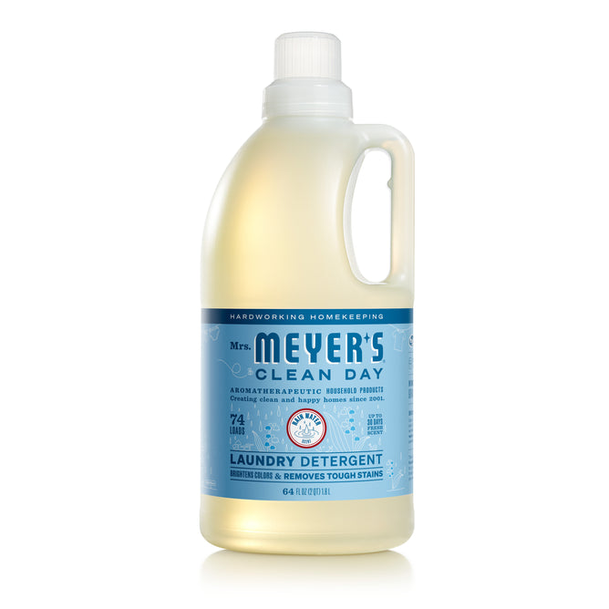 A translucent bottle of Mrs. Meyers Laundry Detergent, filled with pale yellow liquid and sporting a blue label, promises 64 loads and offers a garden-inspired scent.