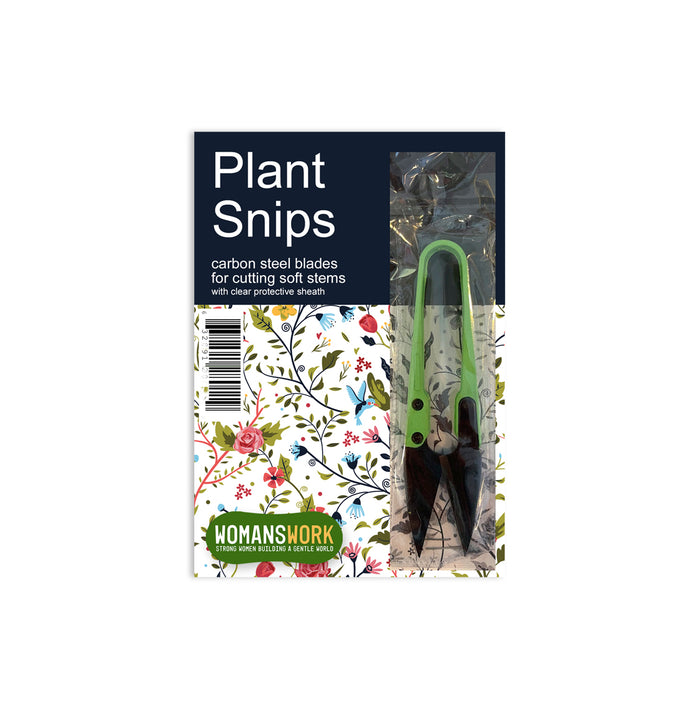 A package of Plant Snips with green handles, carbon steel blades, and a clear protective sheath. The packaging features floral designs and the brand name Womanswork at the bottom.