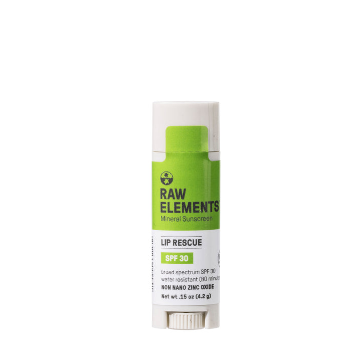 A tube of Raw Elements Mineral Sunscreen Lip Rescue SPF 30, with a white and green label indicating it is water-resistant and contains non-nano zinc oxide.