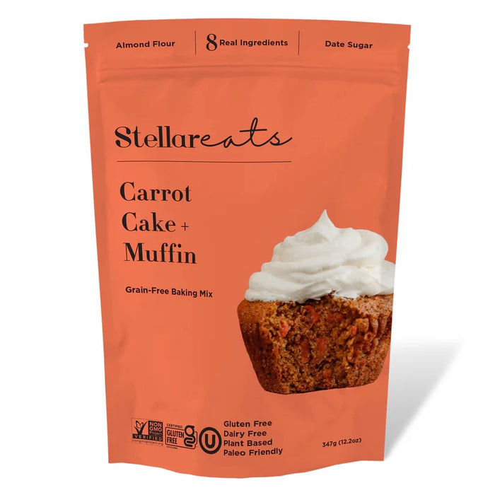 An orange package of Stellareats Carrot Cake + Muffin Grain-Free Baking Mix, featuring a frosted carrot muffin image and labeling for gluten free, dairy free, plant based, paleo friendly, and 8 real ingredients.