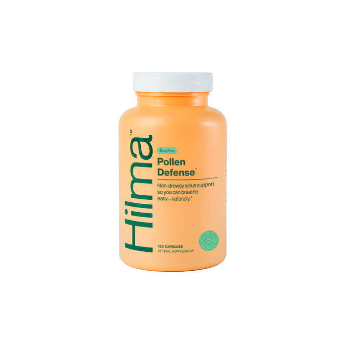 An orange bottle labeled Hilma Pollen Defense, a herbal supplement with 120 capsules, designed for non-drowsy sinus support. The bottle has green text and a green seal near the bottom right.