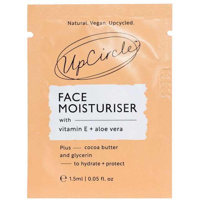 A peach and white sachet labeled UpCircle Face Moisturiser with vitamin E + aloe vera. It mentions cocoa butter, glycerin, hydration, protection, natural, vegan, and upcycled. Size: 1.5ml (0.05 fl. oz).