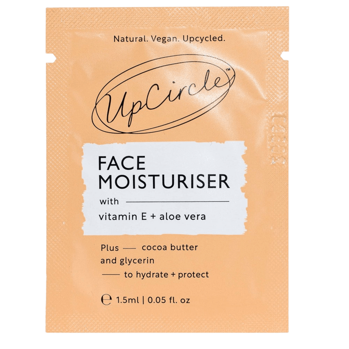 A peach and white sachet labeled UpCircle Face Moisturiser with vitamin E + aloe vera. It mentions cocoa butter, glycerin, hydration, protection, natural, vegan, and upcycled. Size: 1.5ml (0.05 fl. oz).