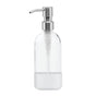 Clear glass soap dispenser with a stainless steel pump and a white silicone sleeve at the base. The sleeve has the text Grove Co. embossed on it. The bottle is empty and standing upright against a white background.