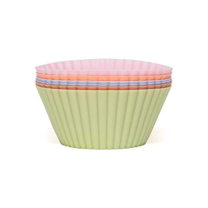 A stack of pastel-colored silicone baking cups, with green on the outside and pink on the inside, arranged neatly against a white background.